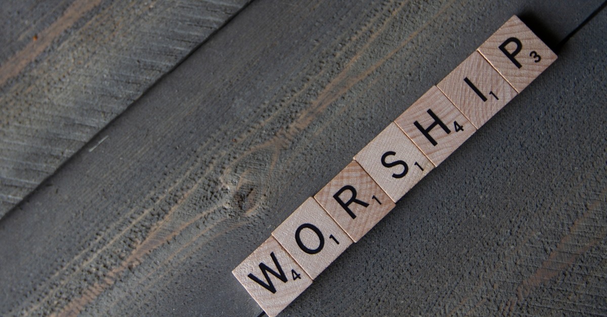 scrabble tiles spelling the word worship
