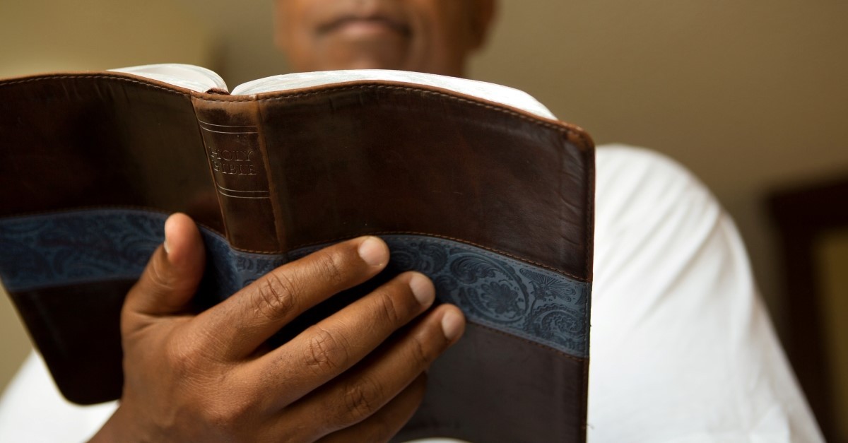 man reading bible